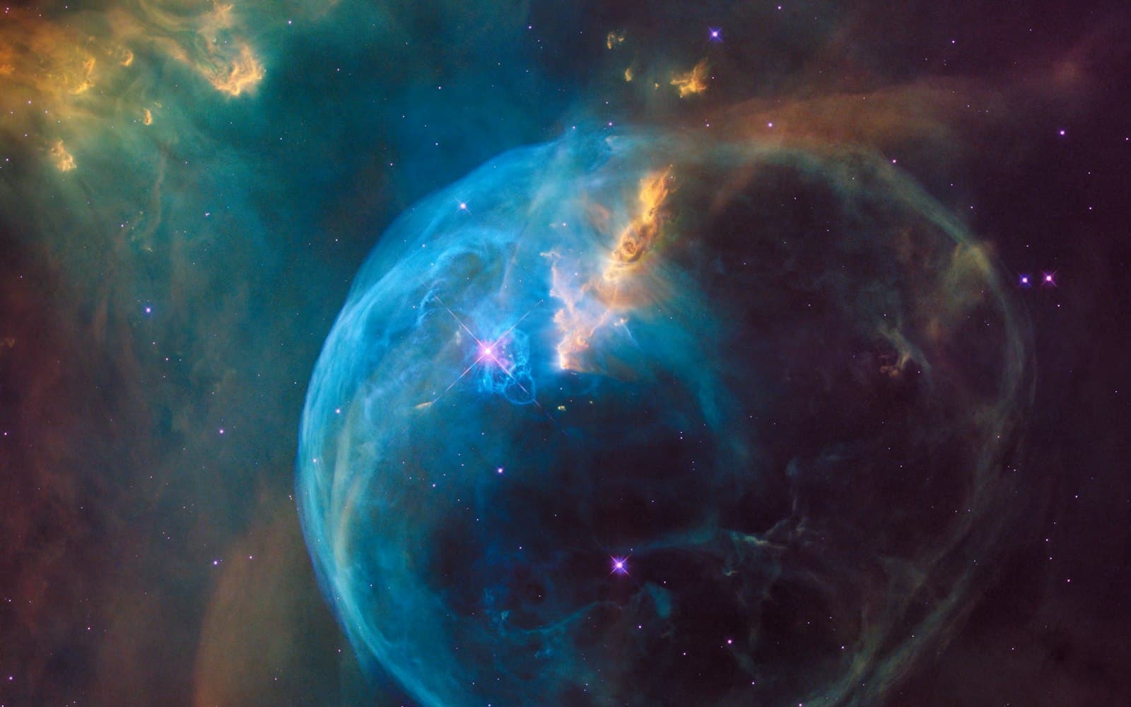 A blue shell of glowing gas around a bright star in a star field